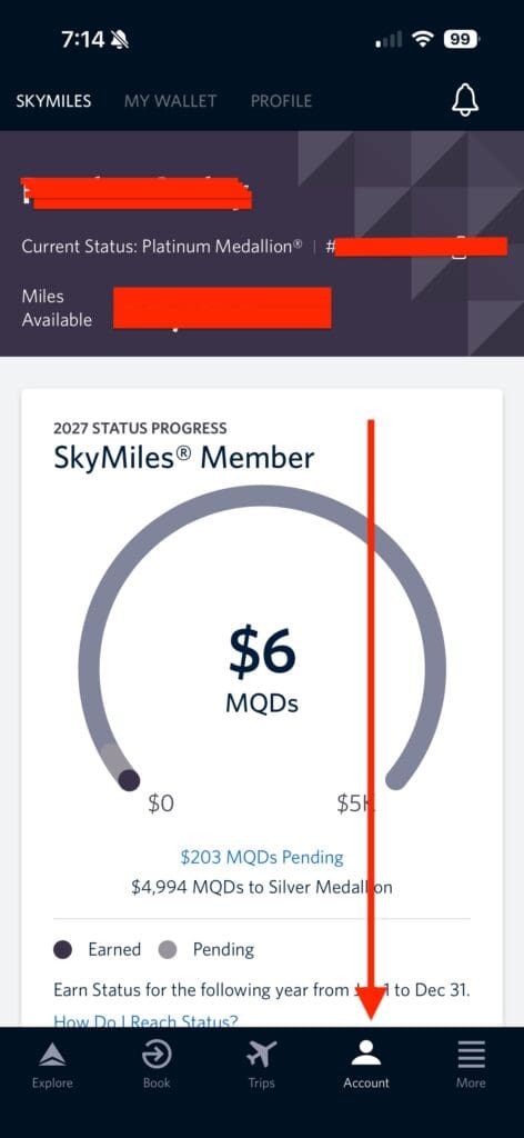 The image is a screenshot of a mobile app interface for managing airline loyalty points. It shows the user's current status as "Platinum Medallion®" and displays available miles, which are redacted. Below, there's a progress section for 2027 status, indicating the user is a SkyMiles member with $6 MQDs (Medallion® Qualification Dollars) earned. A progress bar shows the amount needed to reach $5,000 for Silver Medallion® status. There are $203 MQDs pending, and $4,994 MQDs are needed for Silver Medallion®. The bottom menu includes options like Explore, Book, Trips, Account, and More, with an arrow pointing to the Account icon.