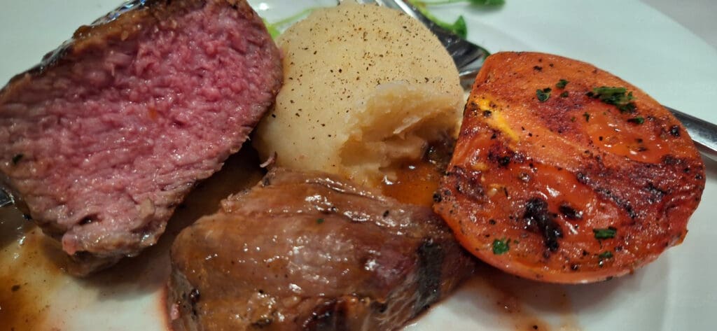 a plate of meat and potatoes