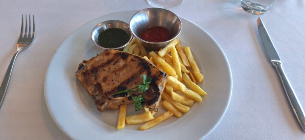 a plate of food with sauces on it