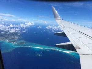 The sandy beach on the ocean looking down from the plane