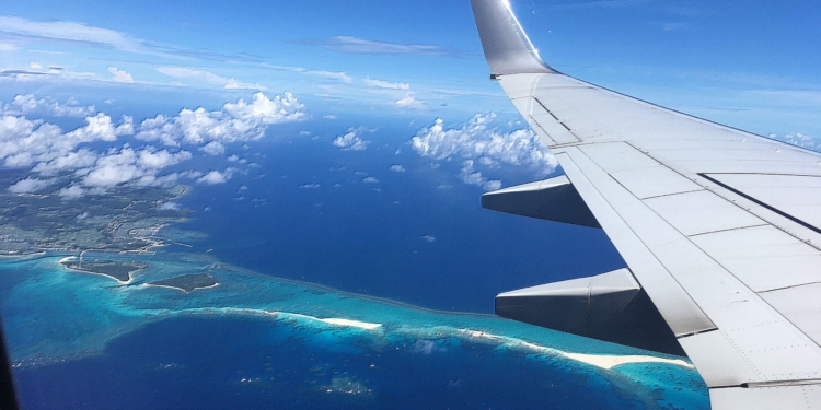 The sandy beach on the ocean looking down from the plane
