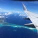 The sandy beach on the ocean looking down from the plane