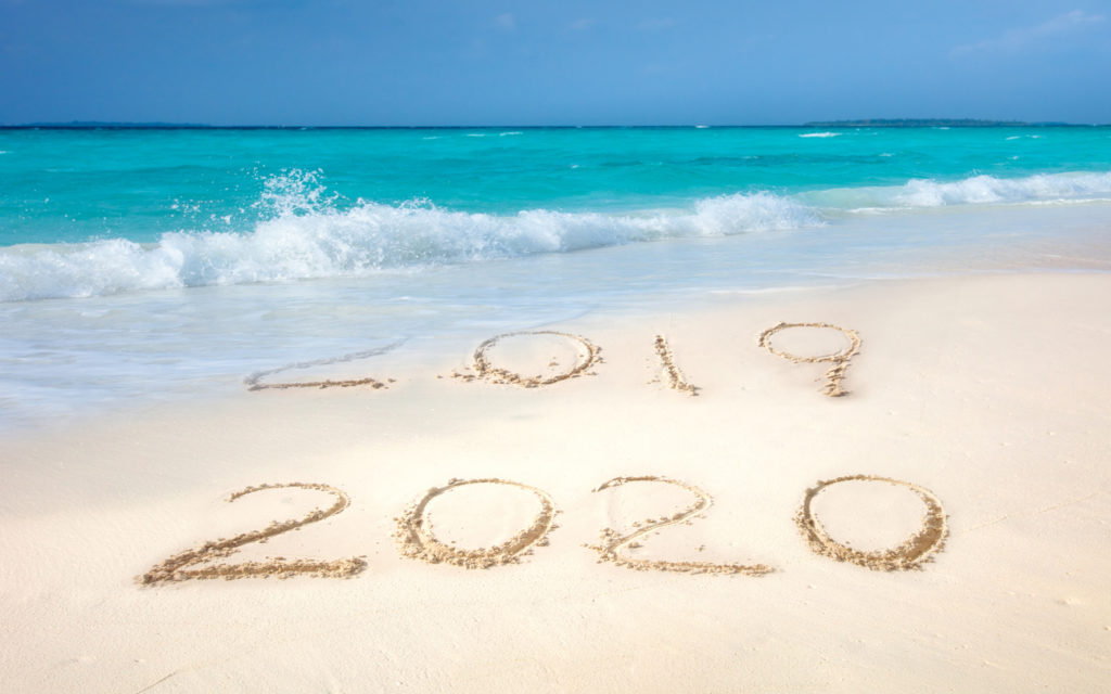 numbers written in sand on a beach