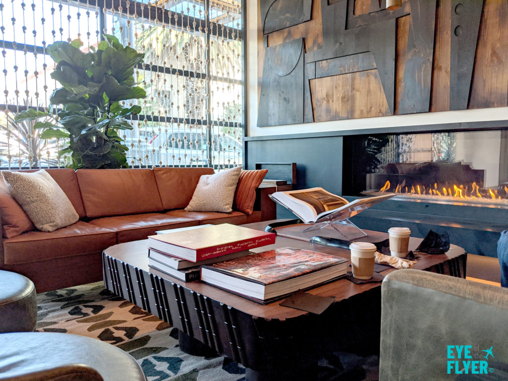Coffee table and fireplace inside the tommie Hollywood lobby 