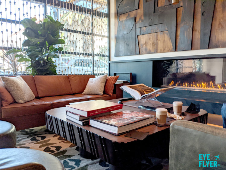 Coffee table and fireplace inside the tommie Hollywood lobby